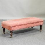 A Victorian style pink upholstered footstool,