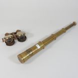 A reproduction miniature brass telescope, together with a pair of brass binoculars,