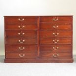 A reproduction mahogany merchants chest of drawers, of large proportions,