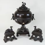 A 19th century bronzed samovar, 45cm high, together with a pair of cast iron fire dogs,