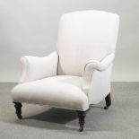 A cream upholstered Howard style armchair,