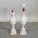 A pair of marble table lamps,