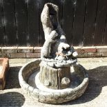A reconstituted stone garden water feature,