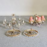 A pair of gilt and glass chandeliers,