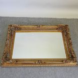 A gilt painted wall mirror,