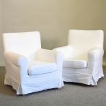 A pair of modern upholstered armchairs,