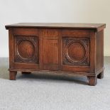 An early 20th century carved oak coffer, dated 1902,