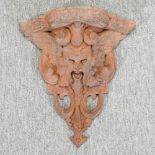 A carved wooden figural corbel,
