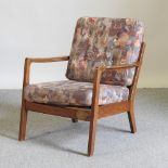 A 1970's teak armchair,