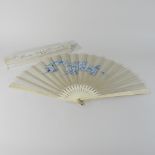 A hand painted carved bone and silk fan, in a fitted box, from Harvey Nichols,