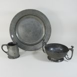 A Tudric style pewter tankard, stamped Liberty and Co, together with a pewter charger, 42cm,