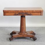 A late Regency mahogany folding card table, on a platform base,