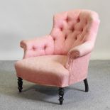 A Victorian pink upholstered button back armchair