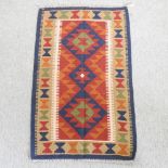 A kelim rug, with all over diamond designs,