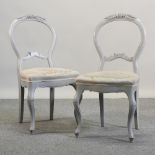A pair of grey painted side chairs