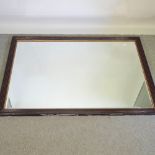 A black painted wall mirror,