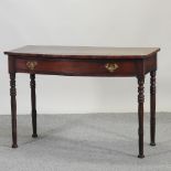 A 19th century mahogany bow front side table, on turned legs,
