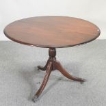 A Regency style mahogany circular dining table,