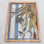 A stained glass window, in an oak frame,