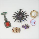 A Basia Zarzycka multi gem set star set brooch, 8cm overall (central stone missing),