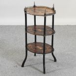 An early 20th century French marquetry etagere, with gilt metal mounts,