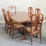 A reproduction walnut twin pedestal dining table, with an additional leaf, 210 x 111cm overall,