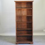 An oak standing open bookcase,