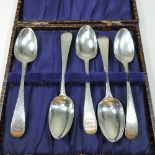 Five bright cut silver coffee spoons, cased,