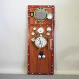 An imitation ship's door, inset with various reproduction ship's dial and telegraph,