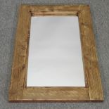 A rustic pine framed wall mirror,