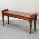A reproduction hand-made oak window seat,