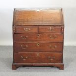 A George III oak bureau,