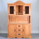 A modern beech dresser, with a plate rack above, and cupboards below,