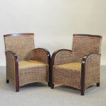 A pair of wicker conservatory chairs
