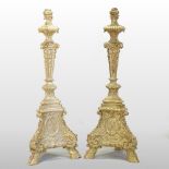 A pair of large continental gilt painted plaster floor standing torcheres,