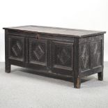 A 18th century and later oak coffer, of large proportions,