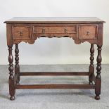 A 17th century style oak side table,