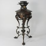 An Arts and Crafts copper oil lamp, in the manner of WAS Benson, with a Hinks patent,