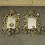 A pair of 19th century ornate brass framed wall mirrors,