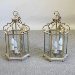 A pair of hexagonal brass ceiling lanterns,