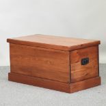 A stained pine blanket box, with black iron handles,