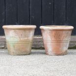 A pair of terracotta garden planters, with incised decoration,