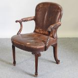 A 19th century continental brown upholstered armchair