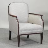 An early 20th century grey upholstered armchair