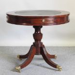 A reproduction hardwood library table, on a splayed base,