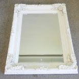 A cream painted wall mirror,