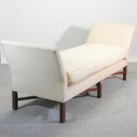A cream upholstered window seat, of large proportions, 223cm,