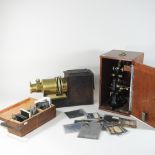 A vintage slide projector, with slides, together with a Hearson no521 microscope,
