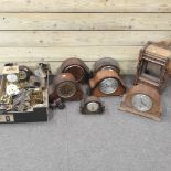 A collection of antique clocks and clock parts,