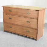 An early 20th century walnut campaign style chest of drawers,